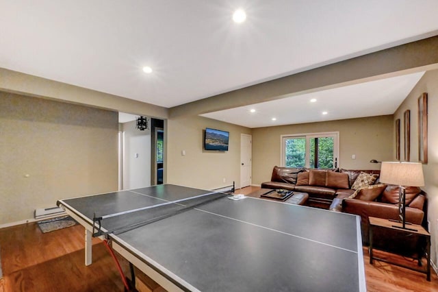 3207 Green Meadow Cir, Pocono Pines, PA 18350 - rec room with wood finished floors, a baseboard radiator, and recessed lighting