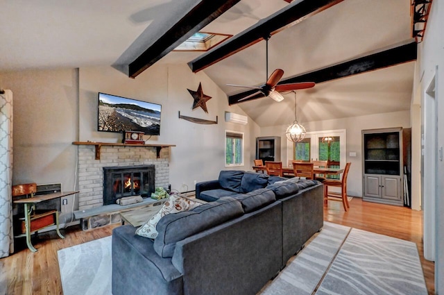 3207 Green Meadow Cir, Pocono Pines, PA 18350 - living room featuring light wood-style floors, beam ceiling, ceiling fan, a brick fireplace, and high vaulted ceiling