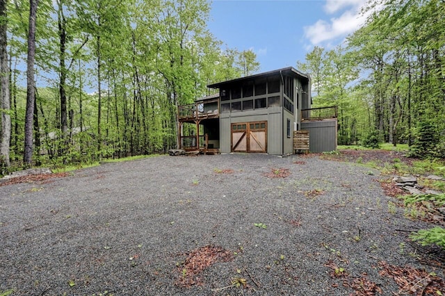 3207 Green Meadow Cir, Pocono Pines, PA 18350 - view of front of property featuring a deck and a sunroom