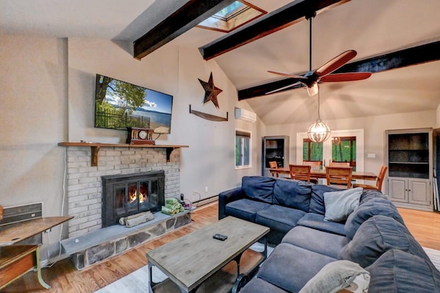 3207 Green Meadow Cir, Pocono Pines, PA 18350 - living area with wood finished floors, a ceiling fan, a fireplace, and a wall mounted AC