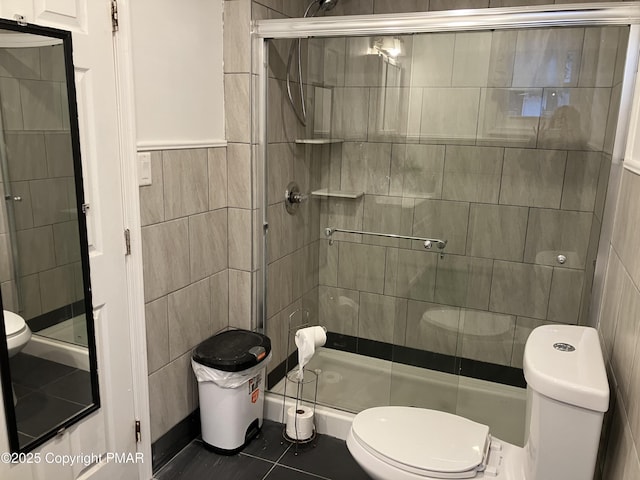 54 Vista Dr, Albrightsville, PA 18210 - full bathroom featuring tile walls, a stall shower, tile patterned flooring, and wainscoting