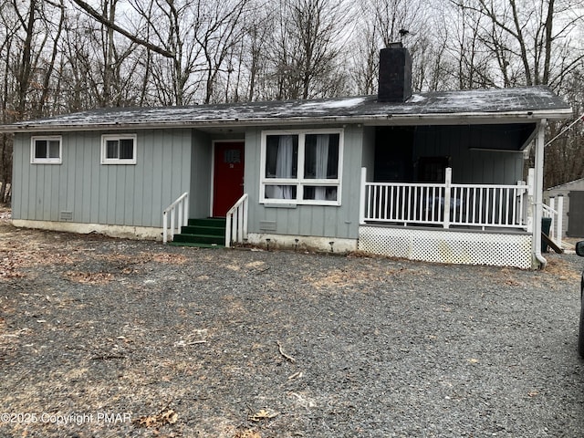 54 Vista Dr, Albrightsville, PA 18210 - view of front of property featuring a chimney, a porch, entry steps, roof with shingles, and crawl space