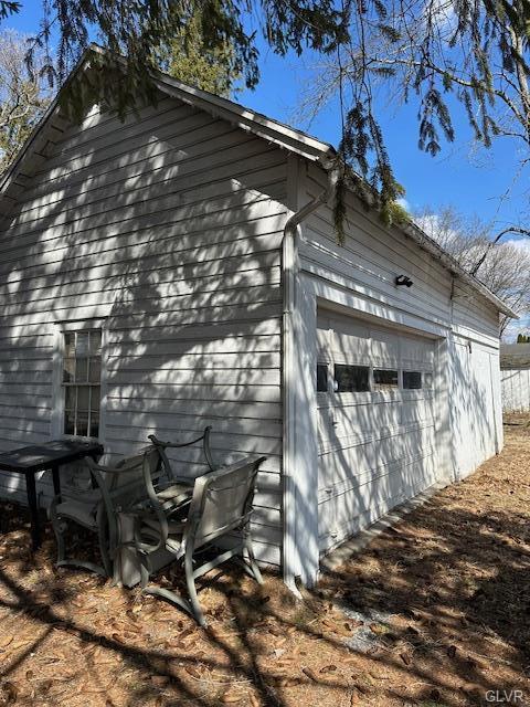 view of side of home with a garage