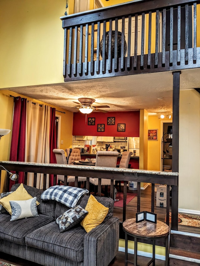 interior space with ceiling fan