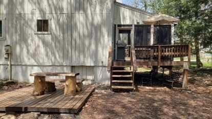 rear view of house with a deck