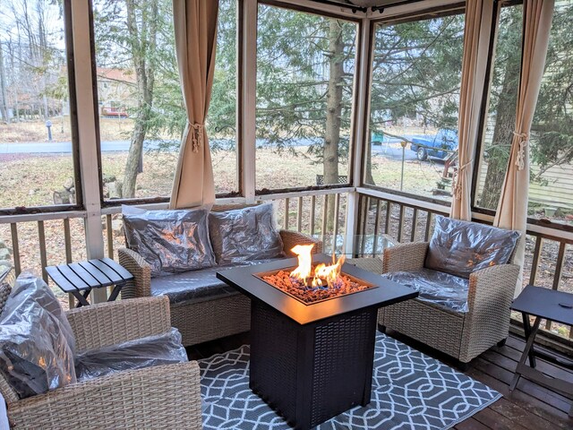 sunroom with an outdoor fire pit