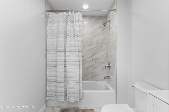 full bathroom with shower / bath combination with curtain, vanity, and toilet