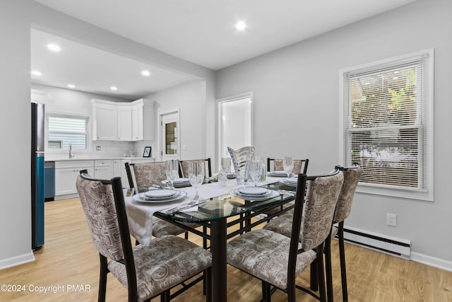 dining room featuring recessed lighting, light wood-style flooring, and baseboards