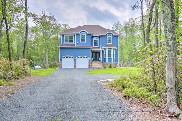 109 Forest Lake Dr, Jim Thorpe, PA 18229 - view of front of property with gravel driveway, a garage, a chimney, a shingled roof, and french doors