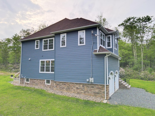109 Forest Lake Dr, Jim Thorpe, PA 18229 - view of side of home with a yard, an attached garage, and a shingled roof