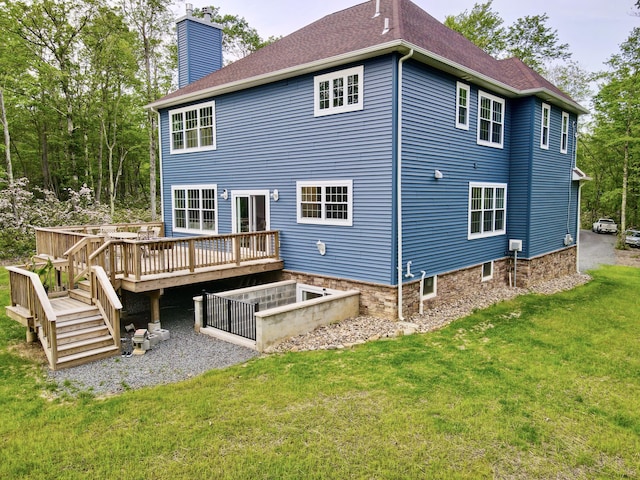 109 Forest Lake Dr, Jim Thorpe, PA 18229 - back of property with a chimney, a yard, a wooden deck, and a shingled roof