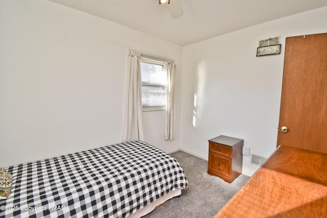 bedroom with ceiling fan, carpet flooring, visible vents, and baseboards