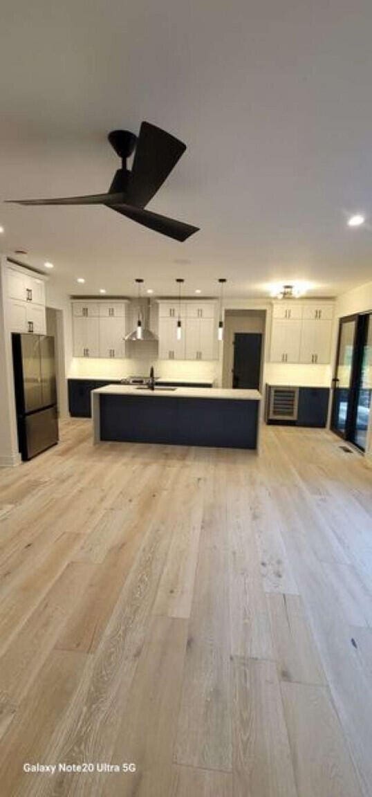 2210 White Oak Trl, Pocono Pines, PA 18350 - unfurnished living room featuring recessed lighting and light wood-style flooring