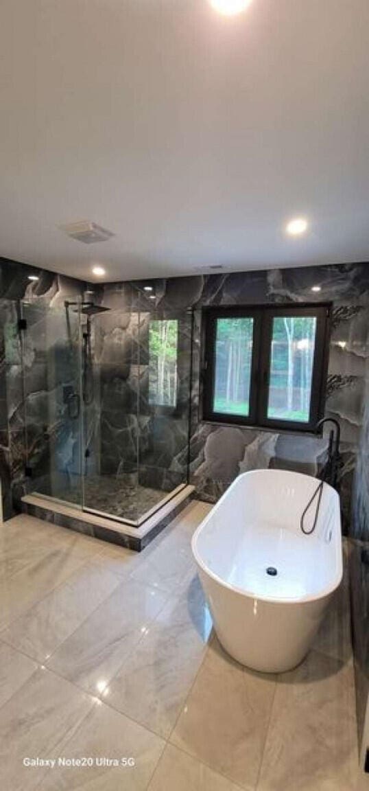 2210 White Oak Trl, Pocono Pines, PA 18350 - bathroom with a freestanding tub, a marble finish shower, and marble finish floor