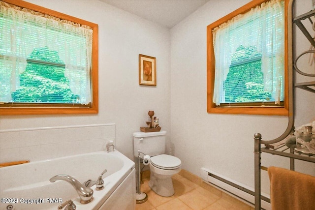 277 Packanack Dr, Clifton Township, PA 18424 - bathroom featuring a bath, toilet, tile patterned floors, and baseboard heating