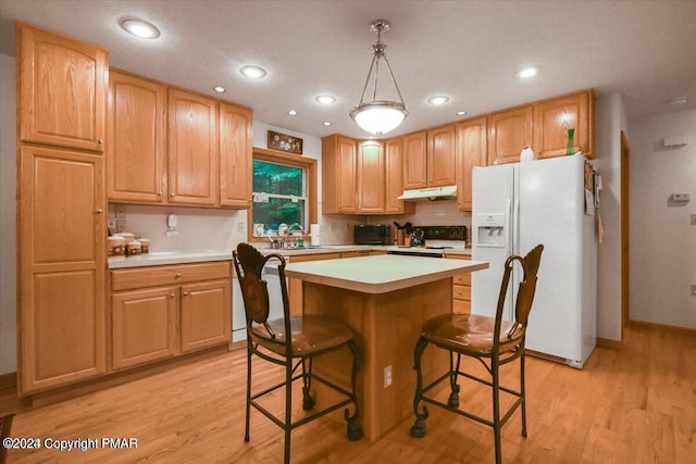 277 Packanack Dr, Clifton Township, PA 18424 - kitchen featuring white refrigerator with ice dispenser, under cabinet range hood, stove, light wood-type flooring, and light countertops