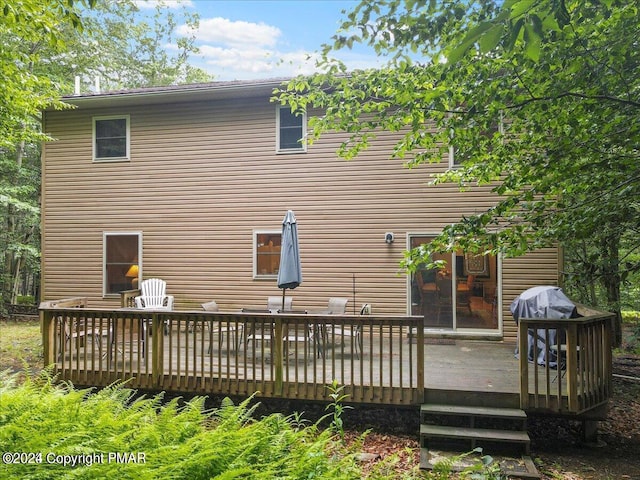 277 Packanack Dr, Clifton Township, PA 18424 - rear view of house with a wooden deck