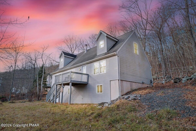 120 St Andrews Dr, Bushkill, PA 18324 - back of house at dusk with stairs and a deck