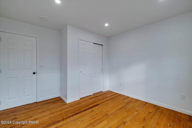 120 St Andrews Dr, Bushkill, PA 18324 - unfurnished bedroom with light wood-style floors, baseboards, recessed lighting, and a closet