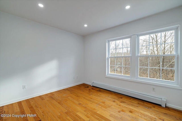 120 St Andrews Dr, Bushkill, PA 18324 - spare room featuring baseboard heating, light wood-type flooring, baseboards, and recessed lighting