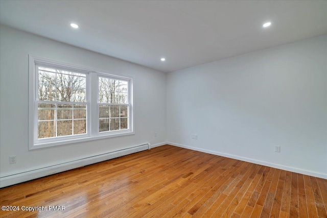 120 St Andrews Dr, Bushkill, PA 18324 - spare room featuring a baseboard heating unit, wood finished floors, recessed lighting, and baseboards
