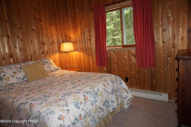 carpeted bedroom featuring a baseboard radiator and wooden walls