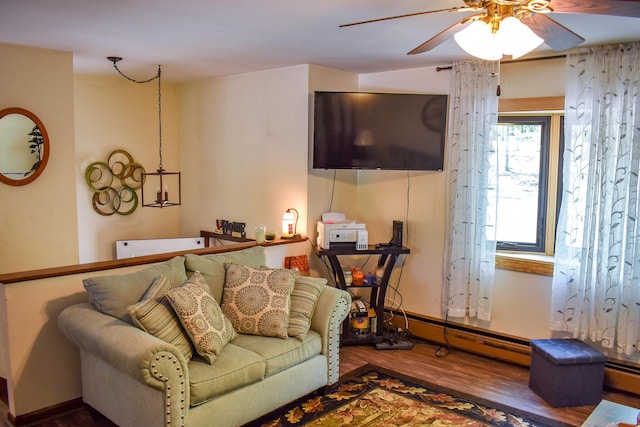 8044 Promontory Dr, White Haven, PA 18661 - living area with wood finished floors, a ceiling fan, and a baseboard heating unit
