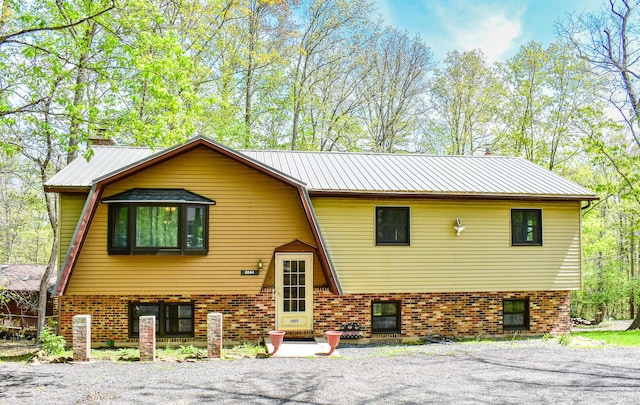 8044 Promontory Dr, White Haven, PA 18661 - view of front facade featuring metal roof and brick siding