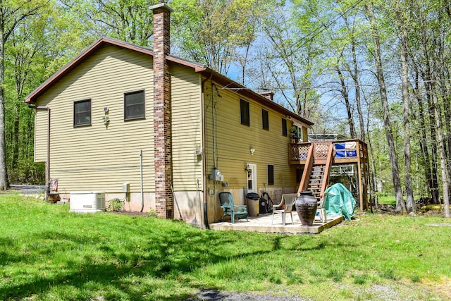 8044 Promontory Dr, White Haven, PA 18661 - rear view of property with a chimney, a patio, a wooden deck, and a yard