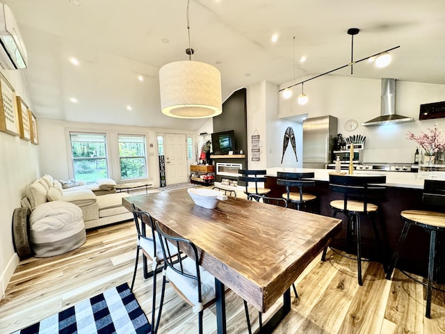 1110 Lehigh Cir, Tobyhanna, PA 18466 - dining room with a wall mounted AC, light wood-type flooring, and recessed lighting