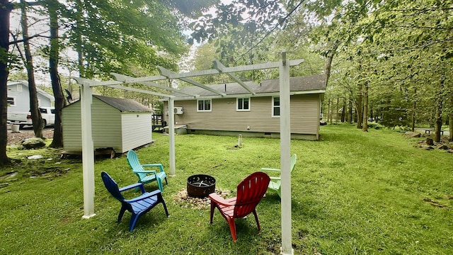 1110 Lehigh Cir, Tobyhanna, PA 18466 - rear view of property featuring a fire pit, crawl space, a shed, and a yard