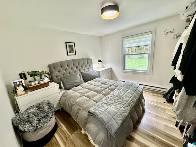 1110 Lehigh Cir, Tobyhanna, PA 18466 - bedroom with wood finished floors and a baseboard radiator