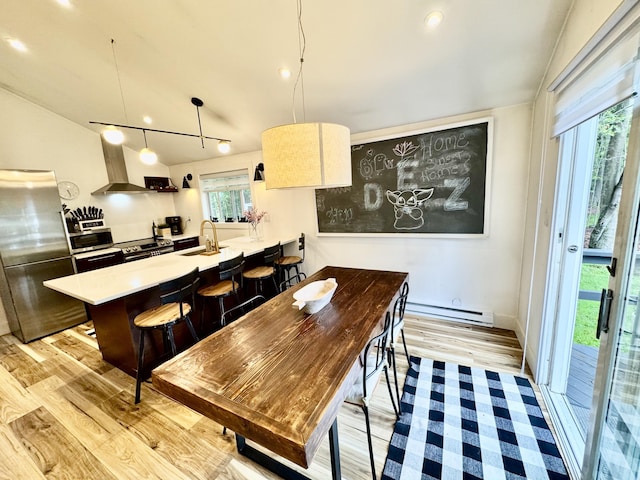 1110 Lehigh Cir, Tobyhanna, PA 18466 - dining area with baseboard heating, light wood-style floors, and recessed lighting