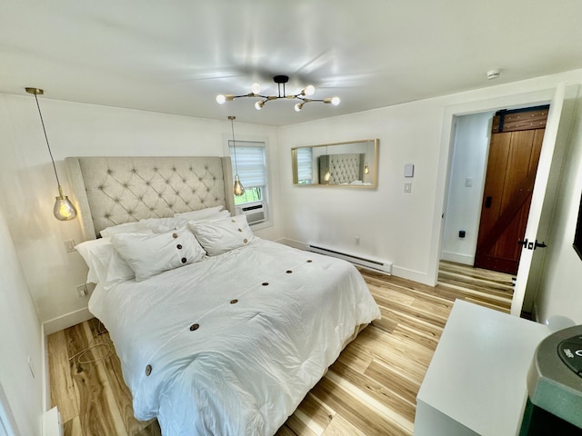 1110 Lehigh Cir, Tobyhanna, PA 18466 - bedroom with a baseboard radiator, a chandelier, and light wood-type flooring