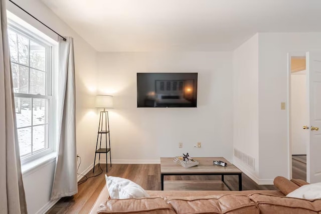 3114 Fairfax Ter, East Stroudsburg, PA 18301 - living area with visible vents, baseboards, and wood finished floors