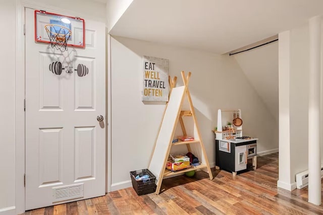 3114 Fairfax Ter, East Stroudsburg, PA 18301 - rec room with light wood-type flooring, baseboards, and visible vents
