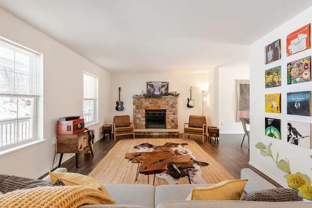 3114 Fairfax Ter, East Stroudsburg, PA 18301 - living room with a wealth of natural light, a stone fireplace, and wood finished floors