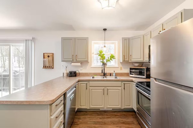 3114 Fairfax Ter, East Stroudsburg, PA 18301 - kitchen with a peninsula, a sink, plenty of natural light, and stainless steel appliances