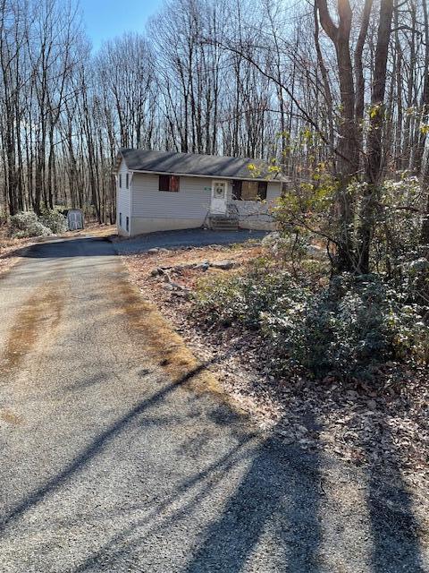 view of home's exterior with driveway