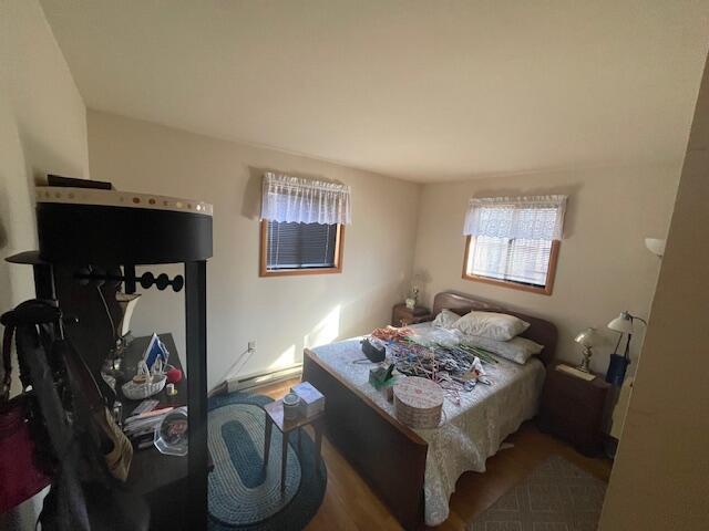 bedroom with wood finished floors