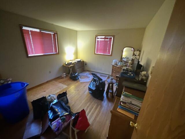 bedroom featuring wood finished floors