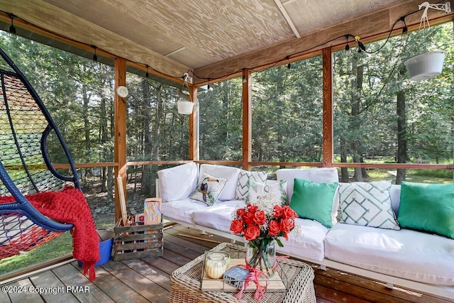 unfurnished sunroom with wood ceiling