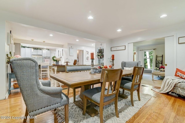 dining room featuring recessed lighting, visible vents, and light wood finished floors