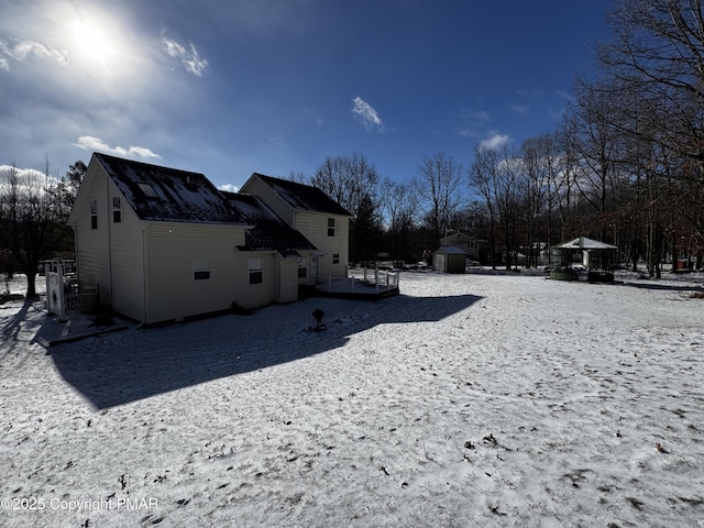 exterior space with an outbuilding and a shed