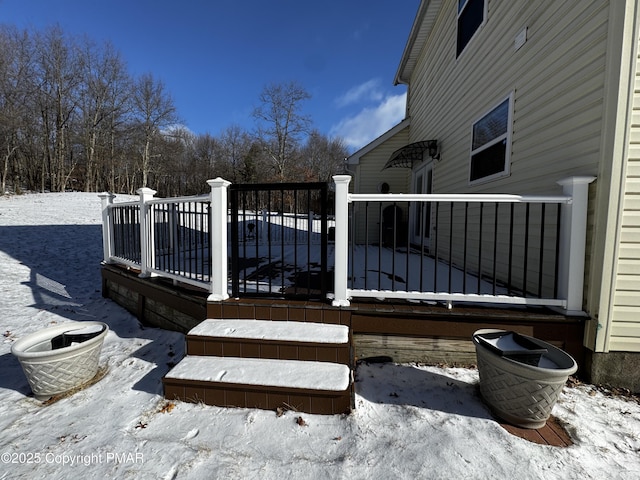 view of snow covered deck