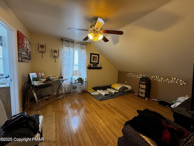 bedroom featuring lofted ceiling, ceiling fan, and wood finished floors