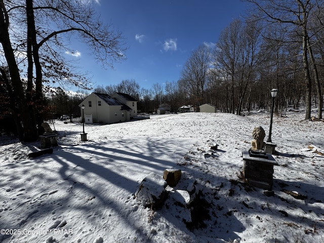 view of yard layered in snow