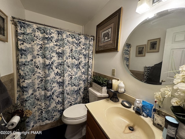 full bathroom with tile walls, vanity, toilet, and a shower with curtain