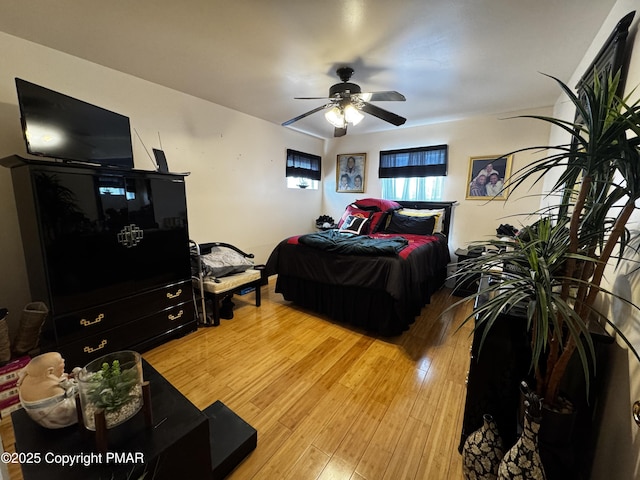 bedroom featuring ceiling fan and light wood finished floors