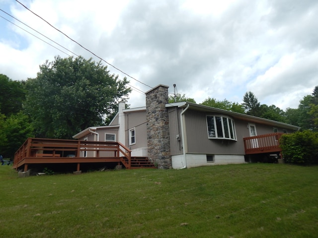 3277 State St, White Haven, PA 18661 - rear view of property featuring a yard, a deck, a chimney, and crawl space